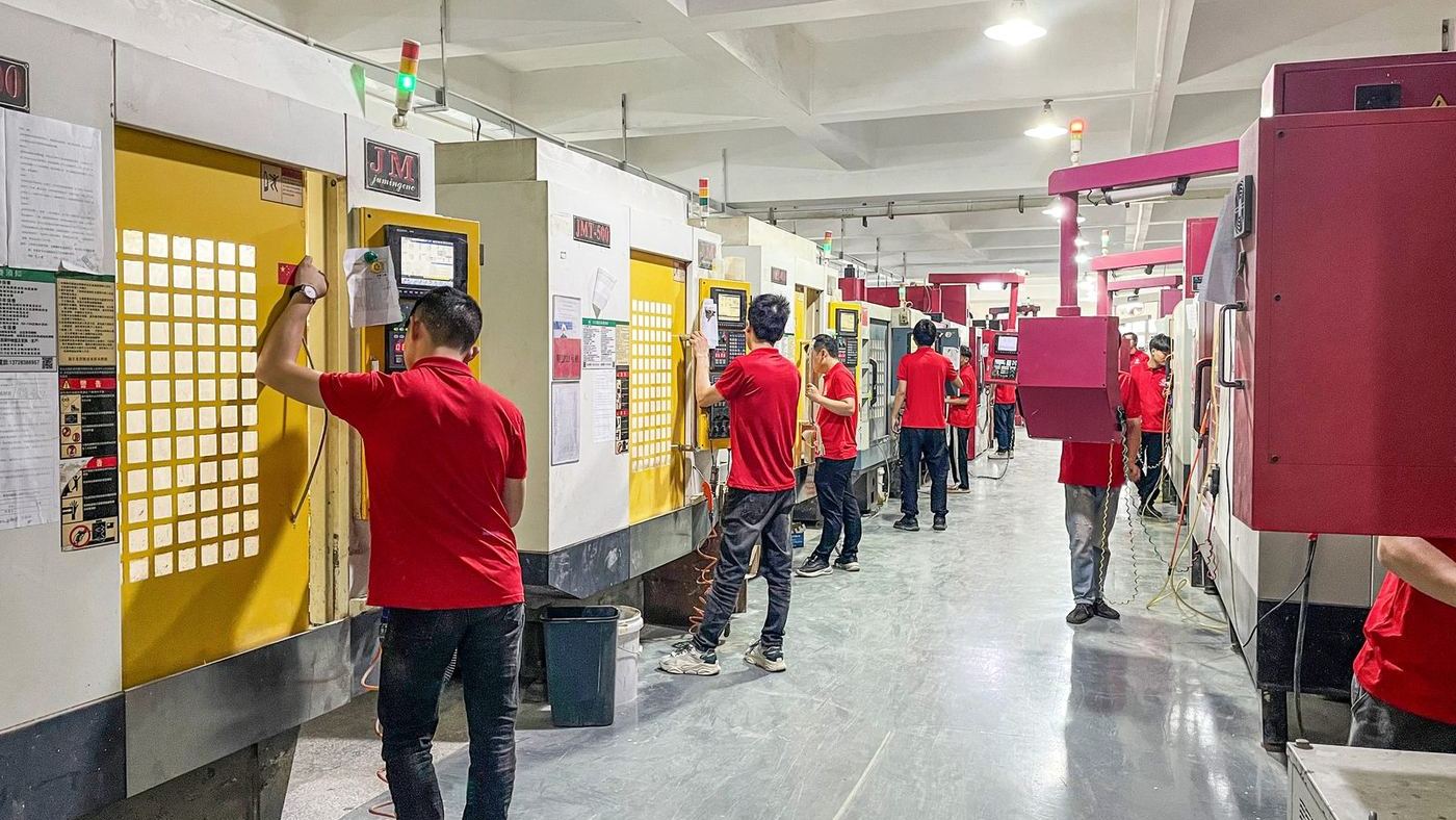 Operators at vertical machining centres along the shop floor